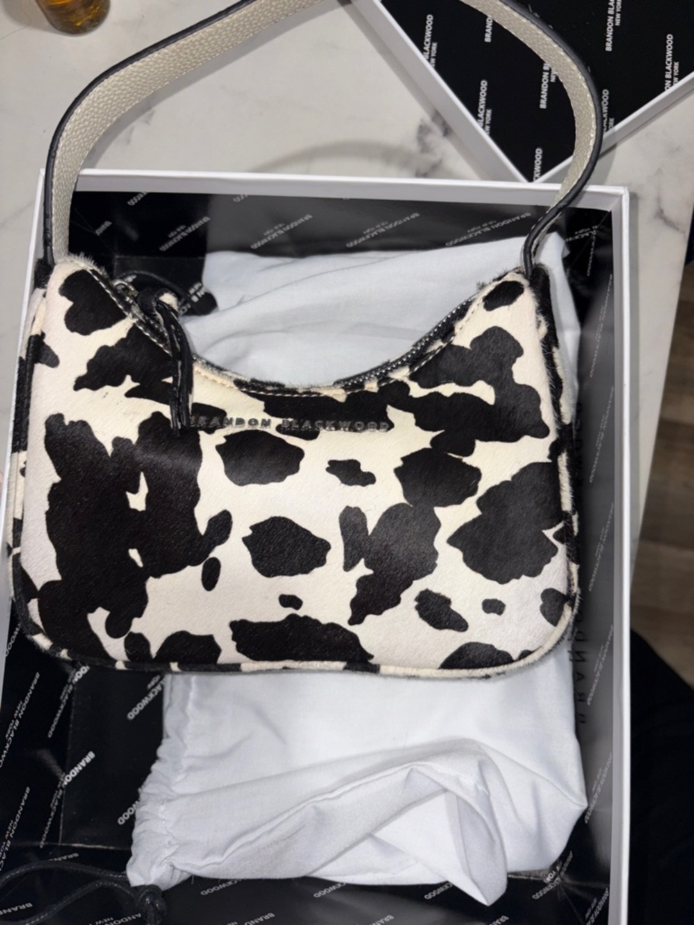 Brandon Blackwood sly Cow-Print Shoulder Bag — Black & White